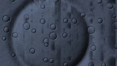 Water droplets create patterns on a dark surface in motion Stock Footage 339209730