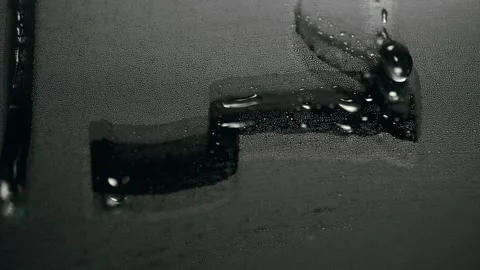 Water droplets dripping down a steamy mirror in dull bathroom light 스톡 동영상 347664503
