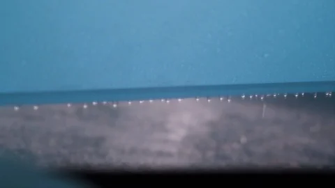 Water droplets fall off of a plastic tent Video stock 92365313