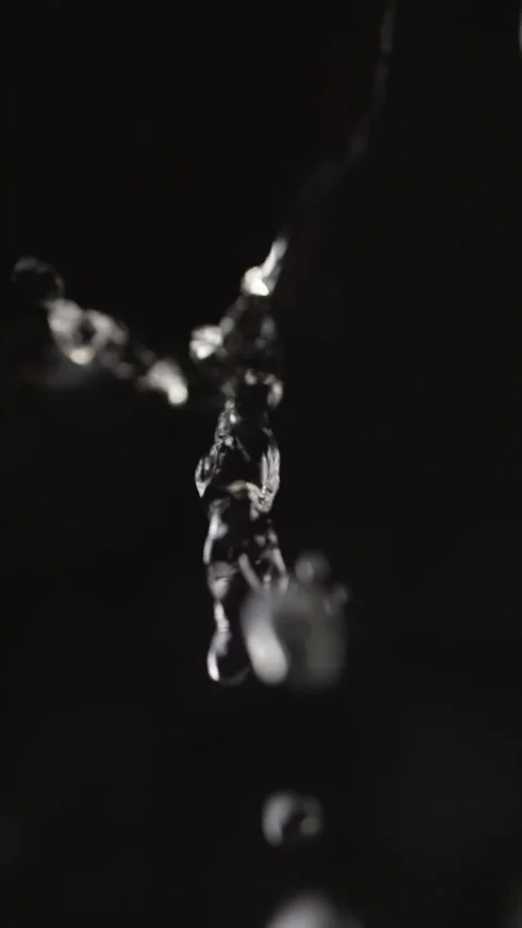Water droplets fall from rocky ledges, each drop distinct in slow motion. A.. Stock Footage 293462906