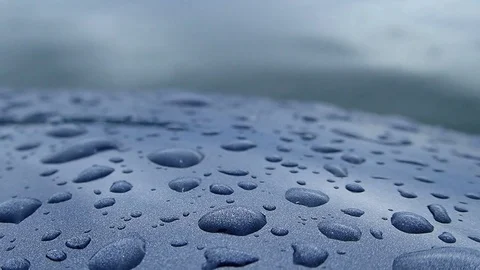 Water droplets on metallic surface by waving water Stock-Footage 84649943