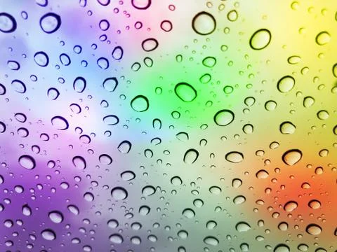 Water droplets on a multicolor surface during heavy rain Stock Photos