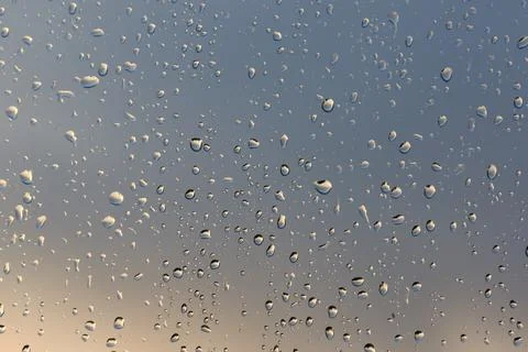 Water droplets raindrops on a window Stock Photos