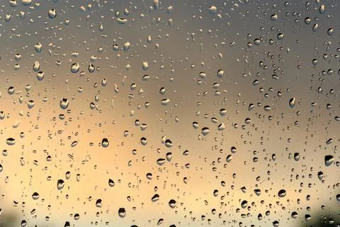 Water droplets raindrops on a window Stock Photos
