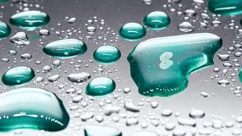 Water droplets on a reflective surface Stock Footage 331998013
