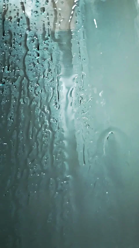 Water droplets Run Down Shower Cubicle Glass, Background visual effect Stock Footage 307178569