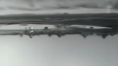Water Droplets Sliding Across Reflective Surface Stock Footage 339301760