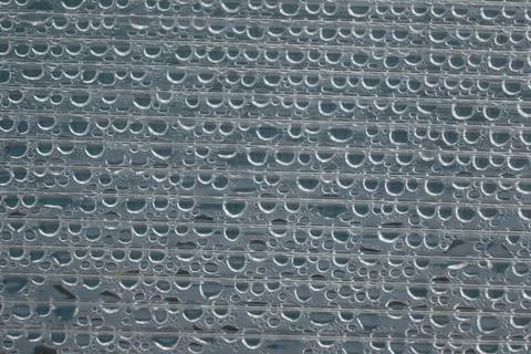 Water droplets on a textured surface Stock Photos