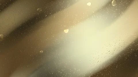 Water droplets on a tinted surface with diagonal light. Stock Photos