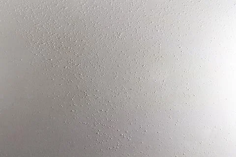 Water droplets on white surface a refreshing texture for design elements Stockfoto's