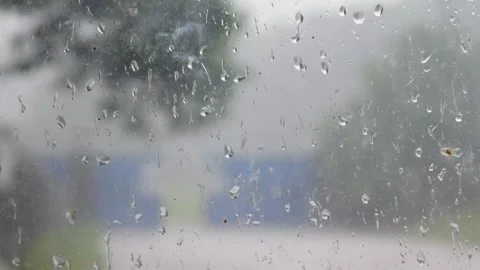 Water droplets on window glass. Close up of rain on glass surface Stock Footage 309590165