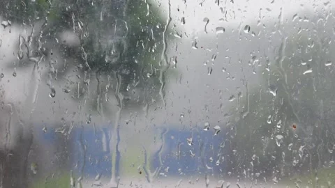 Water droplets on window glass. Close up of rain on glass surface Stock Footage 309590176