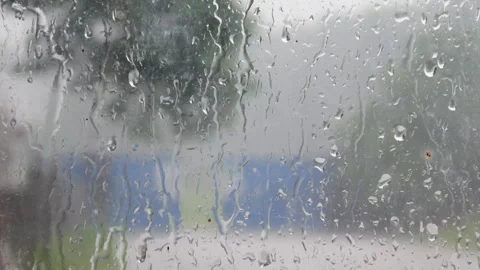 Water droplets on window glass. Close up of rain on glass surface Stock Footage 309590205