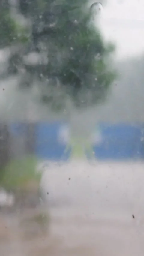 Water droplets on window glass. Close up of rain on glass surface Stock Footage 309590938