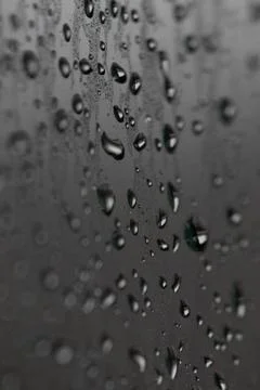 Water droplets on window portrait scape Stock Photos