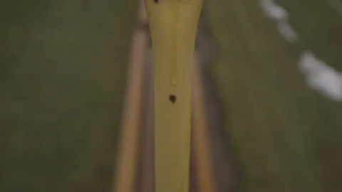 Water Droplets on Yellow Railing Stock Footage 148692171