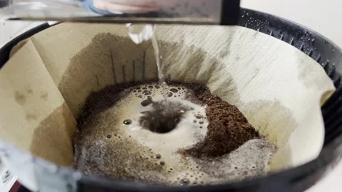 Water dropping in coffee filter for brewing coffee Stock Footage 233221754