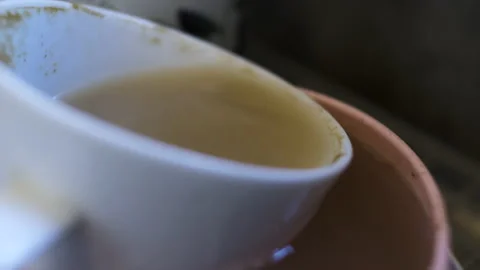 Water Dropping Into Dirty Tea Cup And Bowl In Sink. Macro Close Up, Locked Stock Footage 167193012