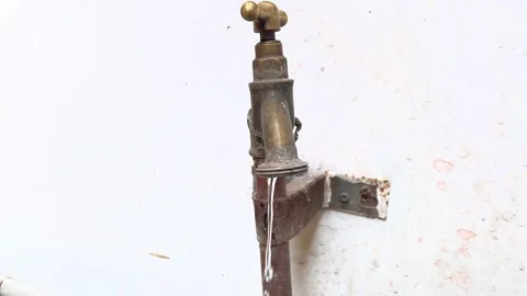 Water dropping from dripping faucet. Stock Footage 242144711