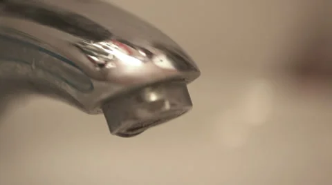 Water dropping from tap - close up; Stock Footage 35879355