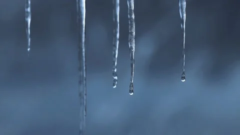 Water droppping from melting iciles Stock Footage 152784068