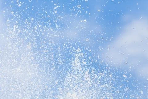 Water drops in the air on the sky. Stock Photos