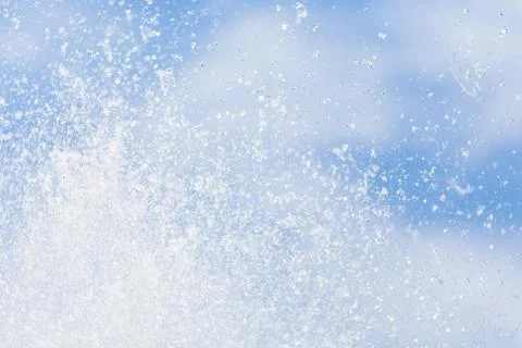 Water drops in the air on the sky. Stock Photos