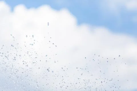 Water drops in the air on the sky. Stock Photos