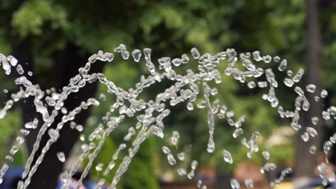 Water drops and splashes fly in an air slow Stock Footage 83054691