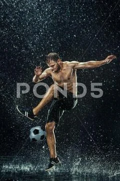 Water drops around football player under water Stock Photos
