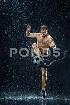 Water drops around football player under water Stock Photos
