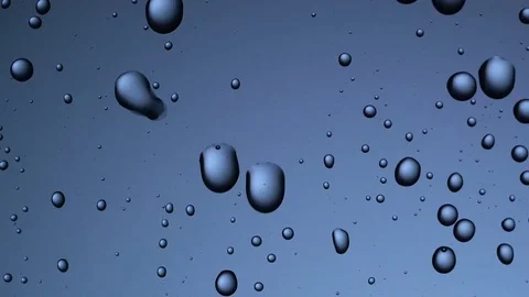 Water drops background. Drops flow down the glass Video stock 75943797