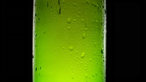 Water drops on the beer bottle. Cold light and refreshing beer Stock Footage 154739418
