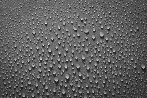 Water drops on black background. Macro. Stock Photos