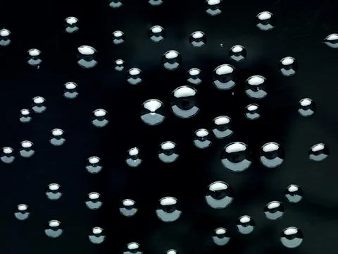 Water drops on black background Stock Photos