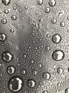 Water drops on black surface. Macro water drops. Stock Illustration