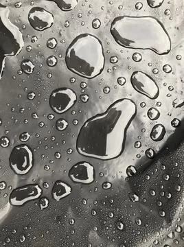 Water drops on black surface. Macro water drops. Stock Illustration