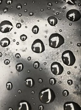 Water drops on black surface. Macro water drops. Stock Illustration