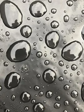 Water drops on black surface. Macro water drops. Stock Illustration