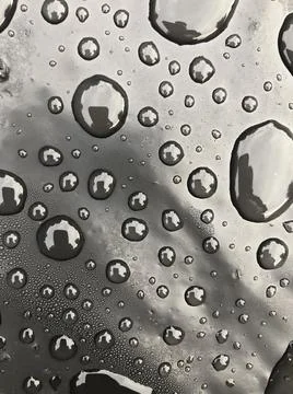 Water drops on black surface. Macro water drops. Stock Illustration