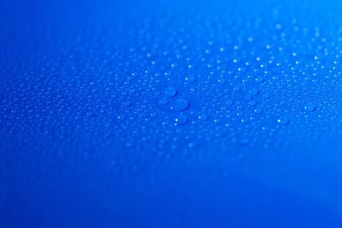 Water drops on blue background drops of liquid (water) on blue background ... Stock Photos