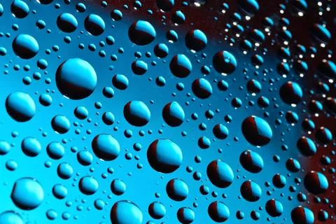 Water drops on blue background Stock Photos