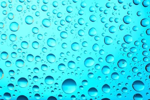 Water drops on blue background Stock Photos