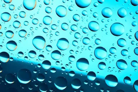 Water drops on blue background Stock Photos