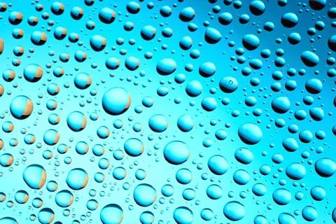Water drops on blue background Stock Photos