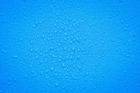 Water Drops On Blue Background. Stock Photos