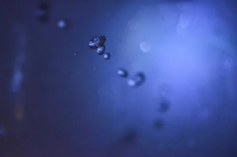 Water drops with blue background Stock Photos