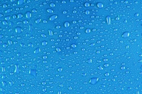 Water drops on blue Stockfoto's
