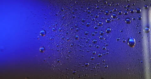 Water Drops on Blue Surface Macro Close-up Stock-Footage 336722633