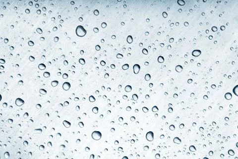 Water drops on brushed metal surface Stock Photos